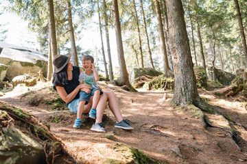 mother and son having rest on vacation in mountains