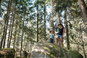 mother and son having rest on vacation in mountains