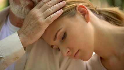 Old father calming adult daughter in time of trouble, support and care concept