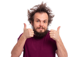 Portrait of handsome bearded man making thumb up gesture, isolated on white background. Happy crazy male smiling and showing success sign. Caucasian man with funny haircut looking at camera.