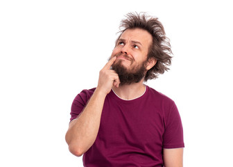 Portrait of thoughtful bearded man, isolated on white background. Crazy male with funny haircut looking up and frowning as thinking making decision. Man with smart face, expressing question and doubt.
