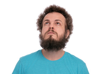 Crazy bearded Man with funny Curly Hair, isolated on white background. Looking up away. Emotions and signs concept.