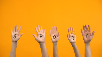 Sport written palms on orange background, workout energy, training activity