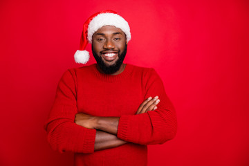Portrait of confident man ready to prepare for newyear wearing santa claus cap jumper isolated over...