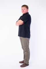 Fototapeta premium Full body shot profile view of overweight man looking at camera