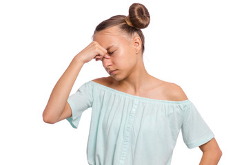 Portrait of teen girl touching her head suffering headache looking tired and sad. Unhappy beautiful...