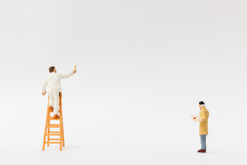 Miniature people : Painter holding a brush with  space for text
