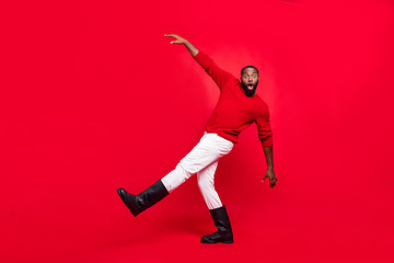 Fototapeta na wymiar Full length body size view of his he nice attractive cheerful cheery foolish clumsy humorous bearded guy having fun fooling isolated over bright vivid shine red background
