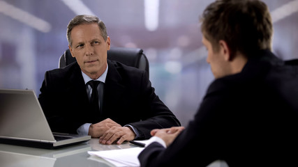 Attentive company CEO listening nervous candidate interview for manager position