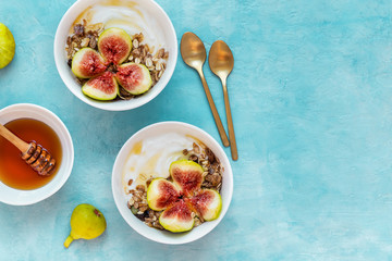 Breakfast with muesli, yogurt, figs in a bowl
