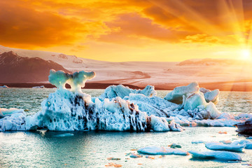 Magical landscape with ice deep in the form of a shark  in the famous Jokulsarlon glacial lagoon in...