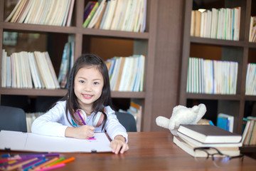 Asia little student girl studying and reading book at school - education and school concept