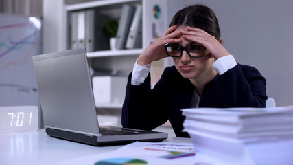 Female office employee feeling unhappy about workload, having no time for rest