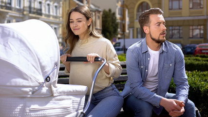 Obraz premium Wife ignoring husband, relations problem, child care priority, family crisis
