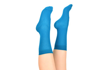 Woman in blue socks isolated on white background. Top view.