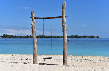Swing on tropical beach in Gili Meno Island, Indonesia
