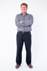 Full body shot of happy overweight businessman smiling with arms crossed