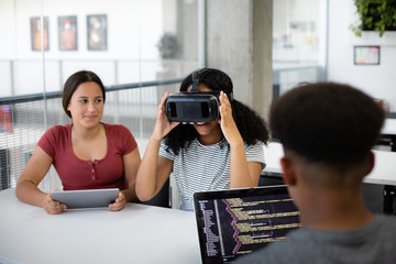 High school students using VR headset in class