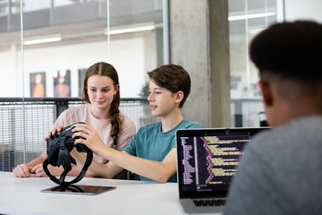 High school students using VR headset in class