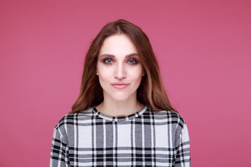 Fototapeta premium Pretty model on the pink background isolated