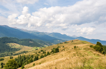 Scenery of the Carpathian mountains with a cellular tower on top of the hill