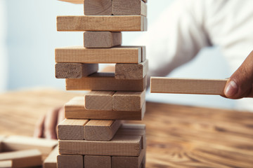 man hand wooden cubes