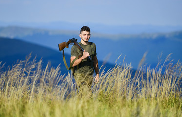 man ready to fire. hunter hobby. soldier in the field. polygon. military style. male in camouflage....