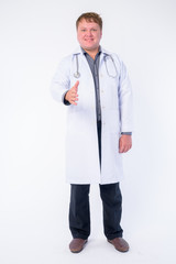 Full body shot of happy overweight man doctor giving handshake