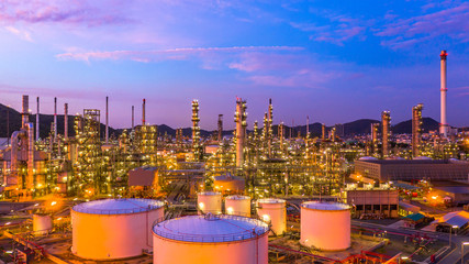 Oil​ refinery​ with oil storage tank and petrochemical​ plant industrial background at...