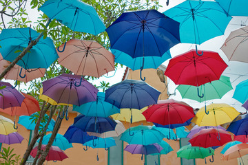 Fototapeta na wymiar Colorful umbrellas background. Colorful umbrellas in the sky. Street decoration. in Venezia Hua Hin & Cha-am Thailand