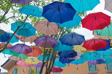 Fototapeta na wymiar Colorful umbrellas background. Colorful umbrellas in the sky. Street decoration. in Venezia Hua Hin & Cha-am Thailand