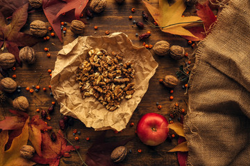 Tasty red apple and walnut fruit top view