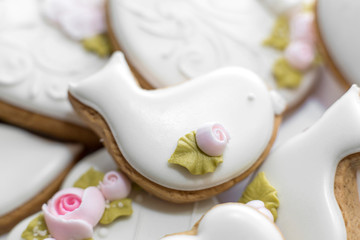 Closeup of gingerbread cookies in a white glaze. Stylish pastries as a decoration for the holidays.