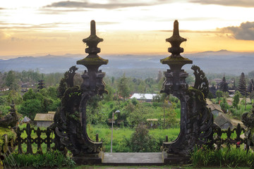 Fototapeta premium Summer tropical landscape at sunset and Pura Besakih on Bali, Indonesia