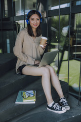 Beautiful girl listening to music in headphones