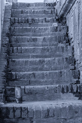 Old brick stairs and decay, dirt in the city