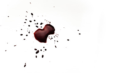 Blood on a white background. Drops and splashes of blood on a white background.