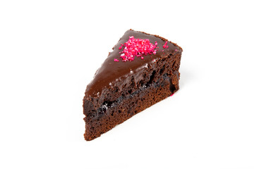 Piece of chocolate cake isolated on white background
