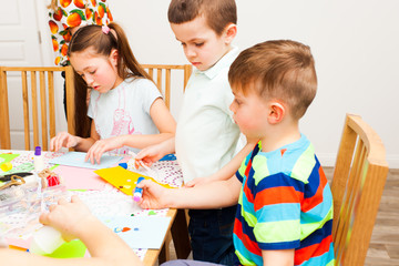Two boys and a girl make lovely postcards in the masterclass