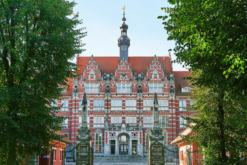 The main building of Gdansk University of Technology or Politechnika Gdanska with emblem above entrance in Poland - obrazy, fototapety, plakaty