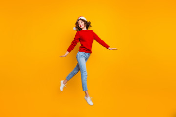 Fototapeta na wymiar Full body photo of pretty lady jumping high walking down street wear knitted sweater isolated yellow background