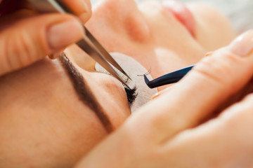 Woman Eye close up during the Eyelash Extension