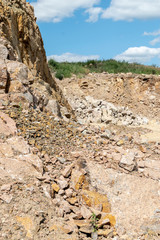 Stone granite Quarry. Rock texture background. Stone on the mountain nature background