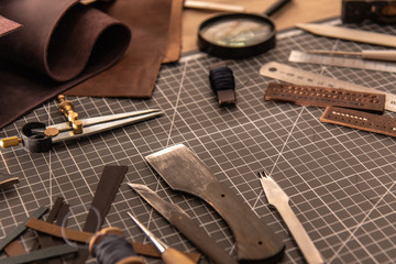 Leather craft tools on a cutting mat, workplace