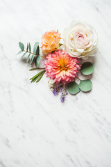 Wedding composition on the white marble background, top view