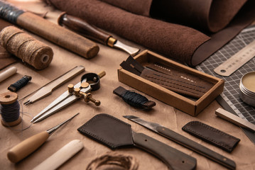 Leather craft tools on a cutting mat, flat lay