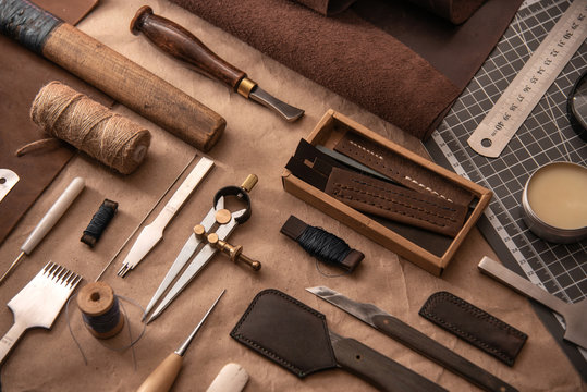 Leather craft tools on a cutting mat, flat lay, top view