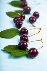 Ripe sweet cherry on a wooden table