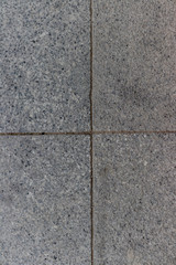 gray pointy and dirty pavement stone square parts centered with good composition