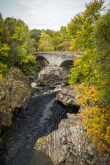 Fototapeta na wymiar Invermoriston city and Glenmoriston riverside area in autumnal colours, Scotland.